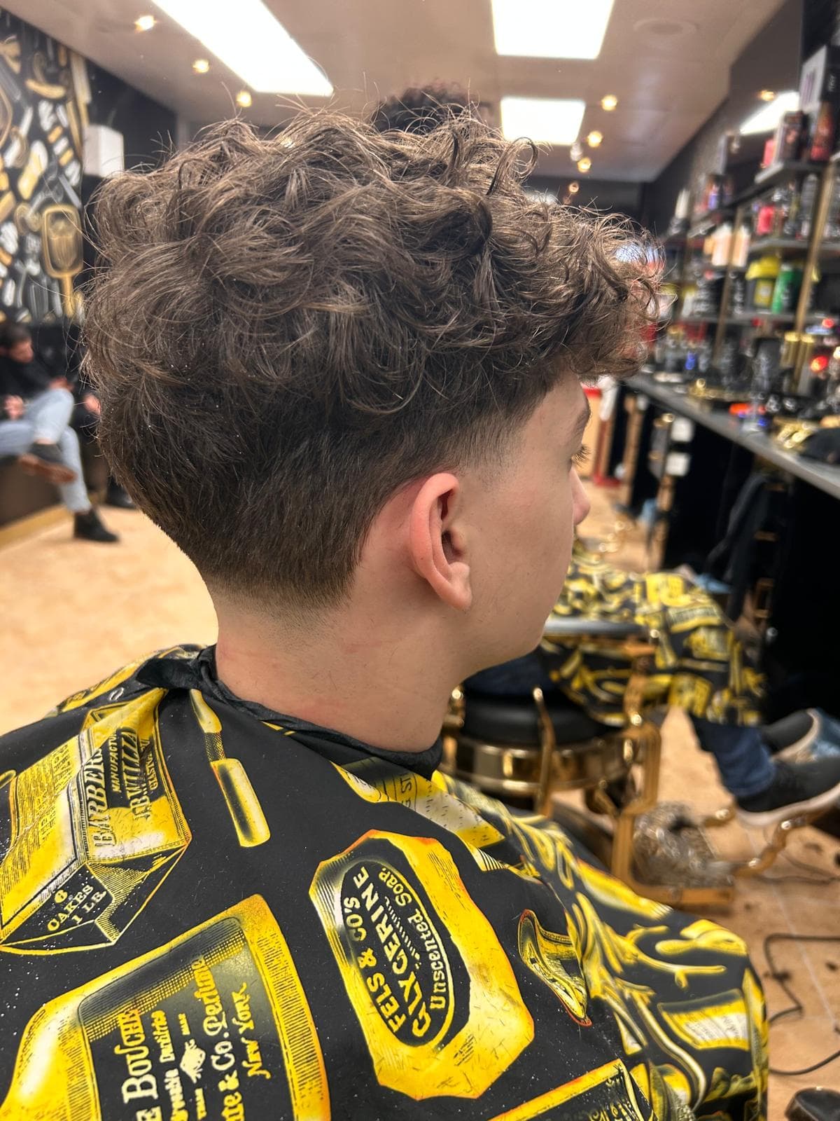 Kids haircut with soft fade and clean side blend at Crown and Comb Barbershop