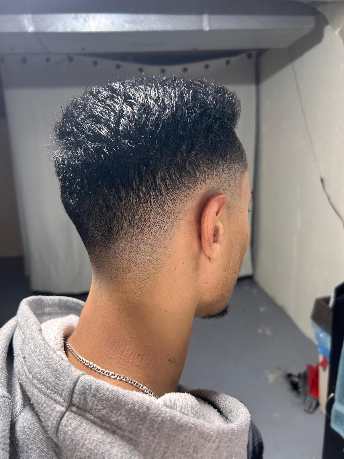 Professional skin fade haircut with clean taper blend at Crown and Comb Barbershop in Ottawa