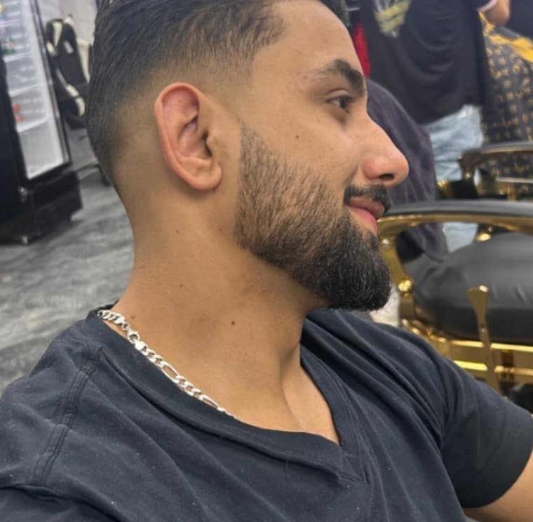 Sharp line up haircut with defined hairline and beard edge detailing